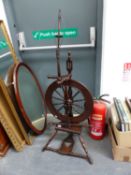 A 19th C. SPINNING WHEEL.