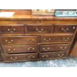 A 19th C. MAHOGANY SIDE CABINET, THE COFFER TOP ABOVE TWO BANKS OF THREE DRAWERS AND CASTER FEET.