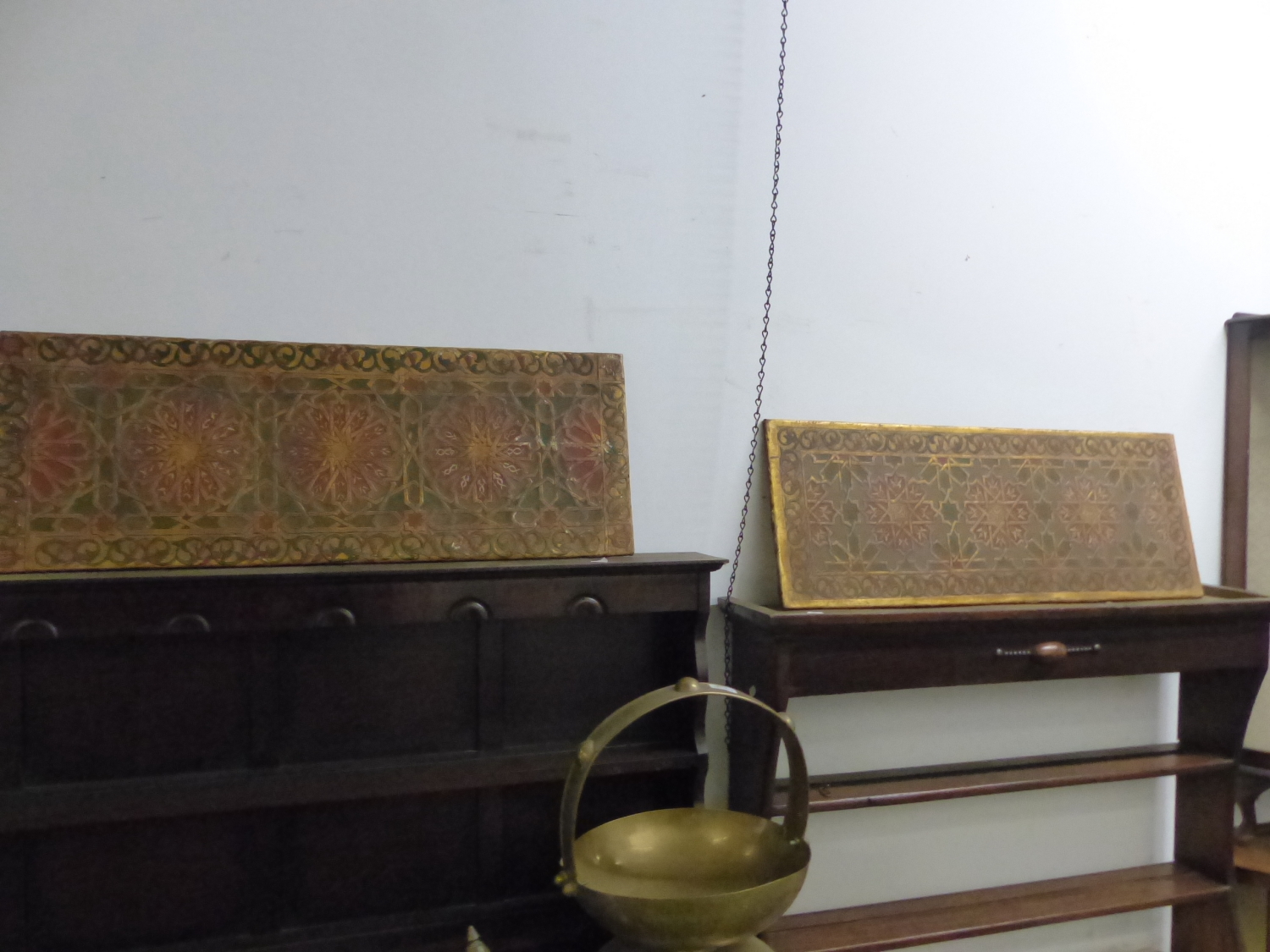 TWO SIMILAR HAND PAINTED EMBOSSED LEATHER ARTS AND CRAFTS PANELS.