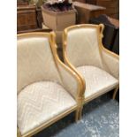 A PAIR OF 20th C. BLOND WOOD SHOW FRAME ARM CHAIRS, THE CURVED TOP RAILS EACH FLANKED BY SWANS