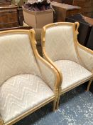 A PAIR OF 20th C. BLOND WOOD SHOW FRAME ARM CHAIRS, THE CURVED TOP RAILS EACH FLANKED BY SWANS