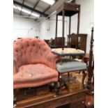 A VICTORIAN BUTTON UPHOLSTERED HOOP BACK ARMCHAIR, THE MAHOGANY LEGS ON CASTER FEET, A FOOT STOOL, A