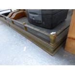 A BRASS FIRE KERB WITH SQUARE SECTION TOP RAIL