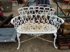 A PAINTED CAST IRON SMALL GARDEN BENCH