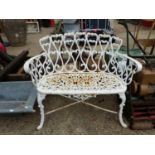 A PAINTED CAST IRON SMALL GARDEN BENCH