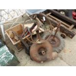 A VINTAGE CAST IRON BELLOWS, TOGETHER WITH A PAIR OF SMALL TRACTOR WHEELS ON AXLE, A VINTAGE PULL