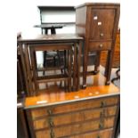 A NEST OF THREE MAHOGANY COFFEE TABLE TOGETHER WITH A BEDSIDE CUPBOARD WITH A DRAWER ABOVE THE