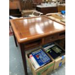 A CHINESE HARDWOOD TABLE THE REMOVABLE TOP OVER DRAWERS CENTRAL TO EACH SIDE AND FLANKED BY