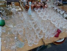 A PART SET OF WATERFORD DRINKING GLASS, OTHER DRINKING GLASS, DECANTERS AND A VASE