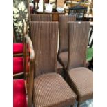 A SET OF FOUR LLOYD LOOM CHAIRS WITH TALL RECTANGULAR BACKS AND SUPPORTED ON CYLINDRICAL LEGS