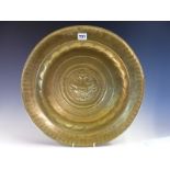 A 17th/18th C. GERMAN BRASS ALMS DISH, THE CENTRAL VASE ENCLOSED BY GUILLOCHE, SCRIPT AND A FLUTED