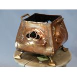 AN ARTS AND CRAFTS COPPER TWO HANDLED SQUARE RIMMED VESSEL PIERCED ON TWO SIDES WITH ART NOUVEAU