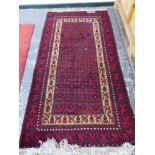 TWO BELOUCH RUGS. 203 x 103 AND 180 x 95cms (2)