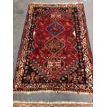 AN ANTIQUE PERSIAN HAMADAN RUG. 174 x 124 TOGETHER WITH A PERSIAN SHIRAZ RUG 180 x 121 CM (2)