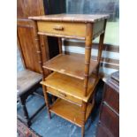 A PAIR OF MODERN FAUX BAMBOO BEDSIDE TABLES.