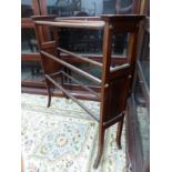 AN EDWARDIAN MAHOGANY INLAID TOWEL RAIL.