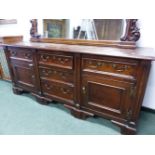 A 19th C.OAK DRESSER, THE THREE CENTRAL GRADED DRAWERS FLANKED BY DRAWERS OVER CUPBOARDS ON