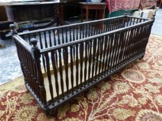 A 19th C. MAHOGANY DOUBLE LENGTH STICK STAND, THE CRADLE SHAPE WITH BALUSTRADE SIDES, TWO METAL