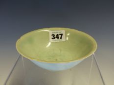 A QINGBAI BOWL, THE CENTRAL INCISED STYLISED FLOWER ROUNDEL WITHIN A RIM WITH FIVE INDENTATIONS.