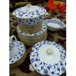 A SPODE COLONEL PATTERN PART DINNER SERVICE, THE FLUTED BODIES PRINTED IN BLUE WITH FLOWERING VINES,