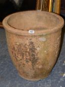 A LIBERTY AND CO. TERRACOTTA FLOWER POT, THE EXTERIOR WITH FOUR RECTANGULAR RELIEF PANELS OF