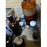 TEN CYLINDRICAL BROWN GLASS BOTTLES WITH SCREW AND CORK TOPS, PAPER LABELLED: URACE, SILVER NITRATE,