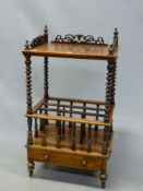 A VICTORIAN WALNUT CANTERBURY TABLE, THE TOP WITH THREE QUARTER PIERCED GALLERY ABOVE BARLEY TWIST