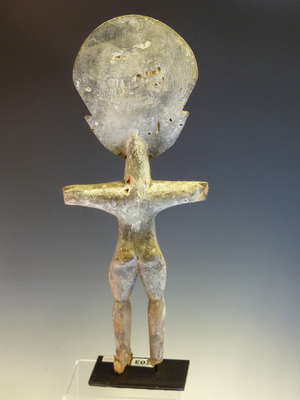 AN ASHANTI CARVED WOOD FERTILITY DOLL STANDING WITH ARMS OUT STRETCHED, THE SURFACE APPLIED WITH - Image 6 of 6