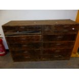 A VICTORIAN PINE CHEST OF THIRTEEN DRAWERS EACH WITH IRON CUP HANDLES AND ARRANGED PRIMARILY IN
