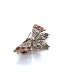 AN ANTIQUE BUTTERFLY BROOCH. THE ABDOMEN AND THORAX SET WITH GRADUATED SEED PEARLS, THE HEAD WITH