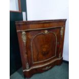 A PAIR OF 19th C. FLORAL MARQUETRIED WALNUT ROUND BACKED CORNER CUPBOARDS MOUNTED IN ORMOLU ON THE
