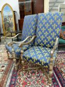 A PAIR OF FRENCH SILVERED WOOD ARMCHAIRS UPHOLSTERED IN BLUE GROUND FLEUR DE LYS MATERIAL, THE