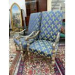 A PAIR OF FRENCH SILVERED WOOD ARMCHAIRS UPHOLSTERED IN BLUE GROUND FLEUR DE LYS MATERIAL, THE