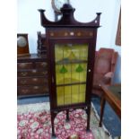 AN ART NOUVEAU MAHOGANY DISPLAY CORNER CUPBOARD, THE SHELF TOP ABOVE FOUR INLAID PEACOCK FEATHER EYE
