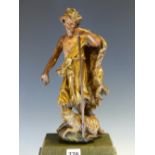 A 19th C. PAINTED CARVED WOOD FIGURE OF CHRIST STANDING OVER THE PASCAL LAMB, HIS ROBE GILT. H