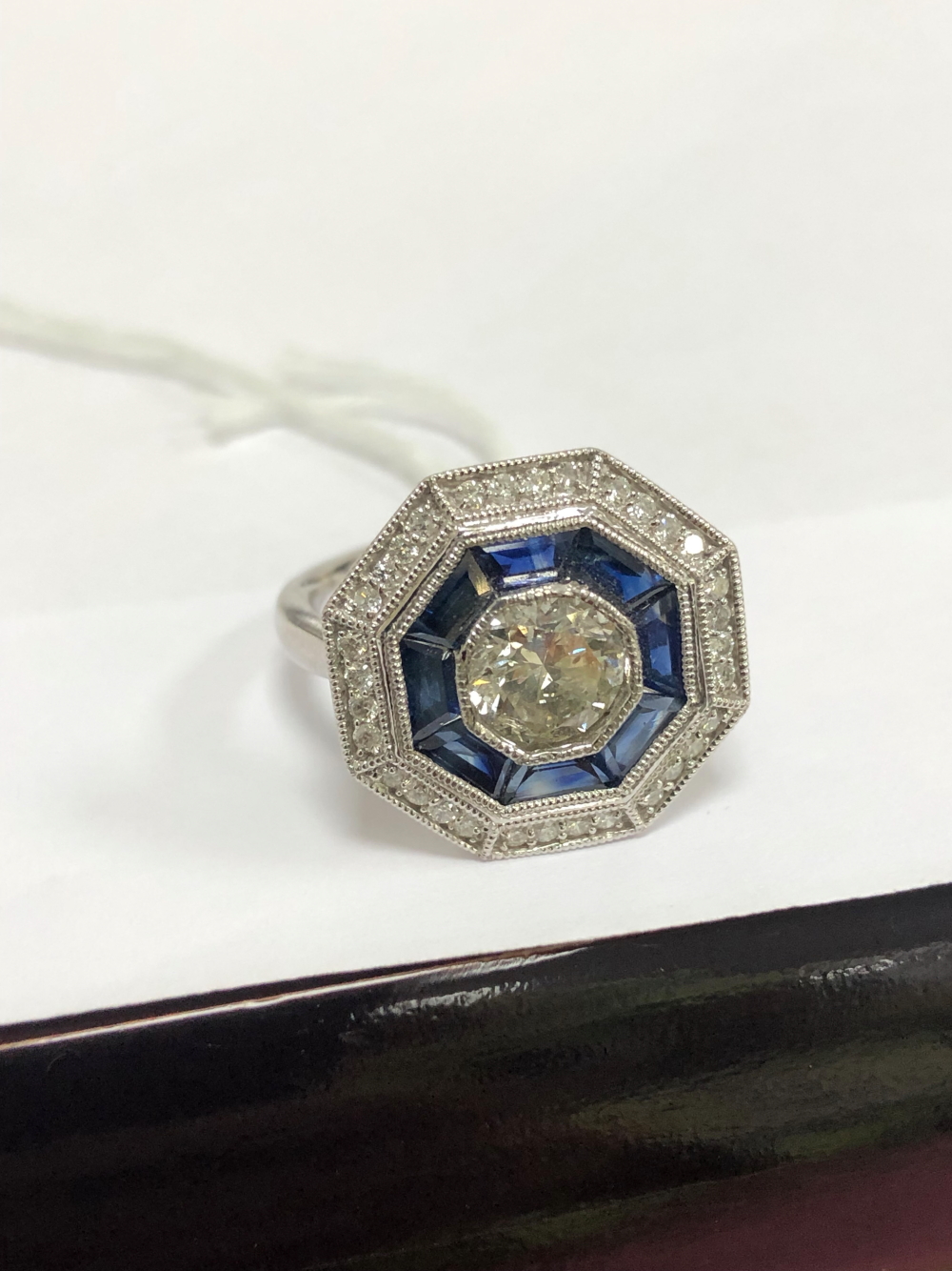 A PLATINUM HALLMARKED SAPPHIRE AND DIAMOND TARGET RING. THE CENTRAL DIAMOND APPROX DIAMETER 6.2mm. - Image 2 of 6