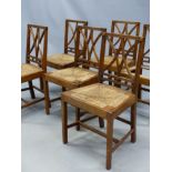 A SET OF SIX 19th C. OAK CHAIRS, THE CURVED AND REEDED BAR BACKS, EACH MEETING TO FORM A CENTRAL