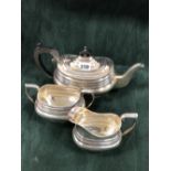 A SILVER THREE PIECE TEA SET, BIRMINGHAM 1951, EACH ROUNDED RECTANGULAR FORM WITH A GADROONED RIM,