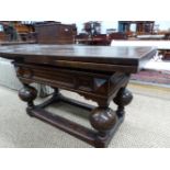 AN ANTIQUE OAK DRAW LEAF TABLE WITH DIAMOND BOSSES ABOVE THE CUP AND COVER LEGS JOINED BY