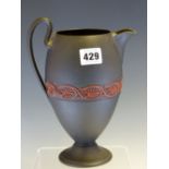 A 19th C. WEDGWOOD BLACK BASALT OVOID JUG SPRIGGED IN RED WITH A BAND OF ANTHEMION MOTIFS AROUND ITS