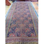 AN ANTIQUE PERSIAN COUNTRY HOUSE GALLERY CARPET. 455 x 207cms