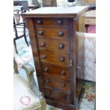 A LATE VICTORIAN MAHOGANY SIDE LOCKING WELLINGTON CHEST OF SEVEN GRADUATED DRAWERS. H 104 X W 49 X D