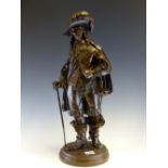 A 19th C. BRONZE FIGURE OF CHARLES 1ST WALKING WITH A CANE, HIS LEFT HAND ON HIS SWORD BELT, HE