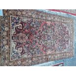 A PERSIAN HAMADAN RUG 255 x 143 cms