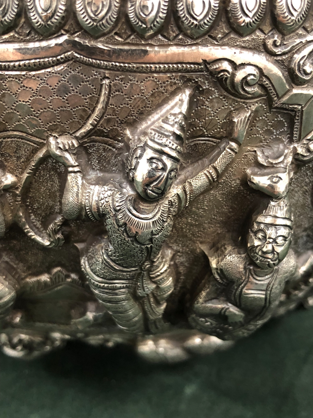 A BURMESE WHITE METAL BOWL, THE ROUNDED SIDES OF THE EXTERIOR RAISED WITH COURT SCENES OF FIGURES - Image 2 of 8