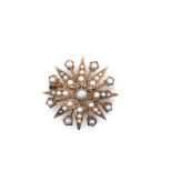 A VINTAGE 9ct HALLMARKED GOLD PEARL STAR BURST BROOCH, DATED 1986, BIRMINGHAM. DIAMETER APPROX 3cms.