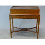 A 19th C. SATINWOOD DISPLAY TABLE, THE GLAZED LID INLAID WITH A DIAMOND BAND, THE BOX LIFTING OFF A