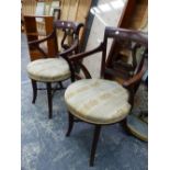 A PAIR OF REGENCY STYLE MAHOGANY LYRE BACKED ELBOW CHAIRS WITH UPHOLSTERED CIRCULAR SEATS ON REEDED