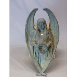 A 19th C. BRONZE WALL MOUNTING FIGURE OF AN ANGEL HOLDING A WREATH, THE WINGS FORMING AN OVAL. H