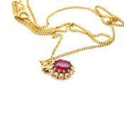 AN 18ct HALLMARKED GOLD RUBY AND DIAMOND CLUSTER PENDANT WITH DIAMOND SET BALE, SUSPENDED ON AN 18ct